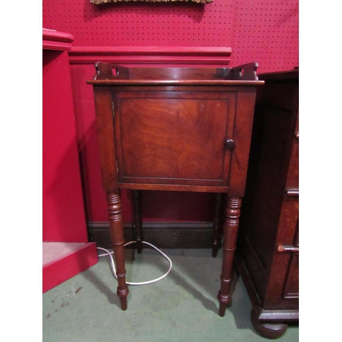 4069 - Circa 1840 a mahogany nightstand the fret handle three quarter raised back over a single door on rin... 