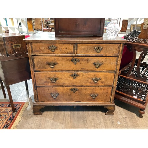 4078 - An 18th Century walnut chest of two over three drawers with feather edge banding, D-moulding ogee br... 