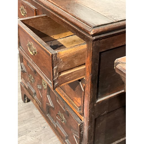 4143 - A 17th Century oak chest of two over two drawers with geometric moulding, later bracket feet, 92cm h... 