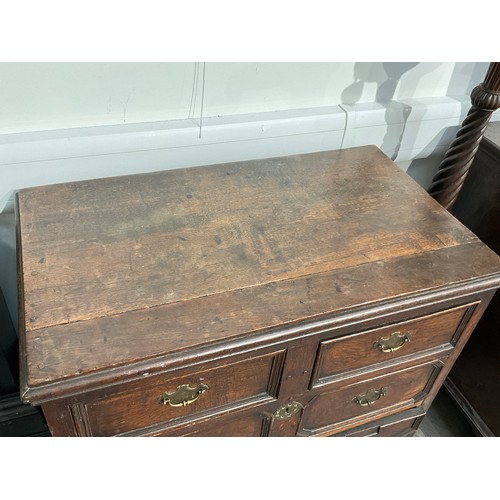 4143 - A 17th Century oak chest of two over two drawers with geometric moulding, later bracket feet, 92cm h... 