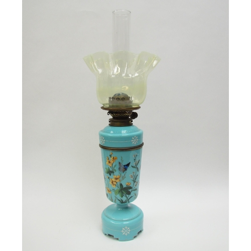 4187 - A Victorian painted turquoise glass oil lamp decorated with bird and butterfly, with vaseline glass ... 