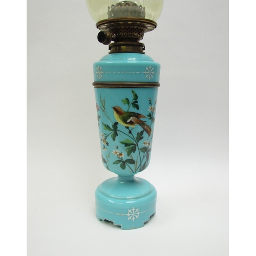 4187 - A Victorian painted turquoise glass oil lamp decorated with bird and butterfly, with vaseline glass ... 