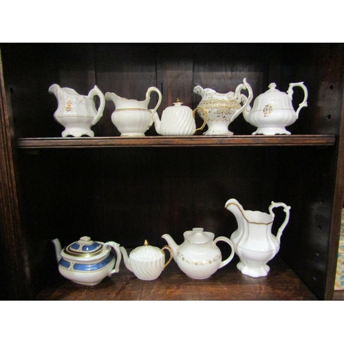 4236 - A selection of mostly Victorian cream and gilt tea pots and milk jugs including Royal Doulton and Bo... 