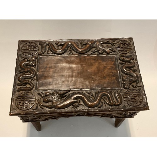 4242 - A Korean hardwood tabletop chest, the lift-up lid opening to reveal storage, over a shaped frieze, o... 