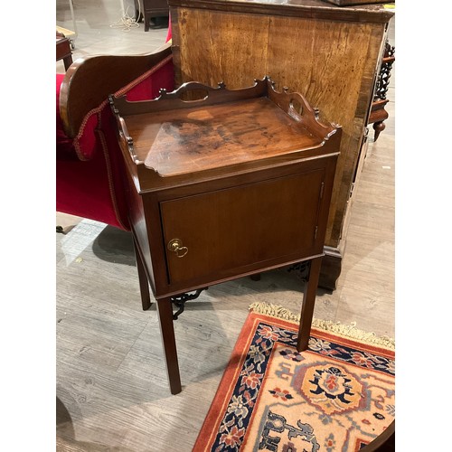 4246 - A George III mahogany nightstand the fretwork raised gallery over a single door cupboard on internal... 