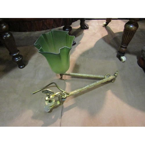 4247 - An ornate brass extending electric reading lamp with frosted green glass shade and table clamp