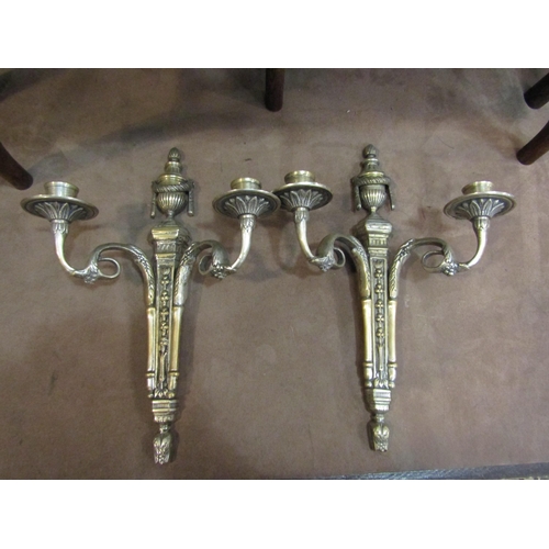 4256 - A pair of brass ornate wall sconces in the Regency taste with traces of original plate, 36cm high   ... 