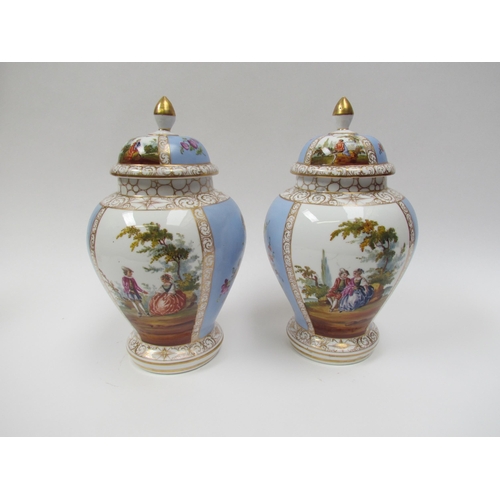 4310 - A pair of 19th Century Dresden lidded urns with handpainted cartouches, floral spray detail, 27cm ta... 