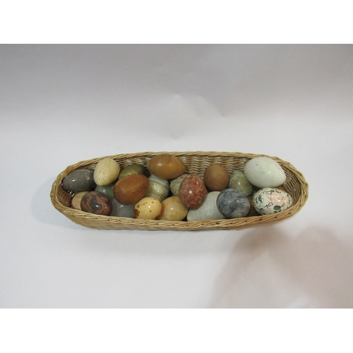 4319 - A basket containing various eggs, including stone, wood and painted   (R)  £40