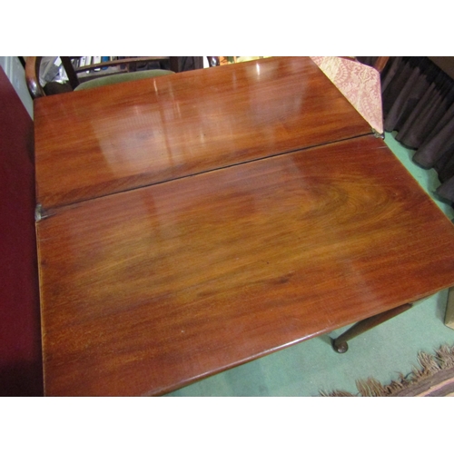 4001 - A George II mahogany side table with fold-over hinged top the single frieze drawer on lappet carved ... 