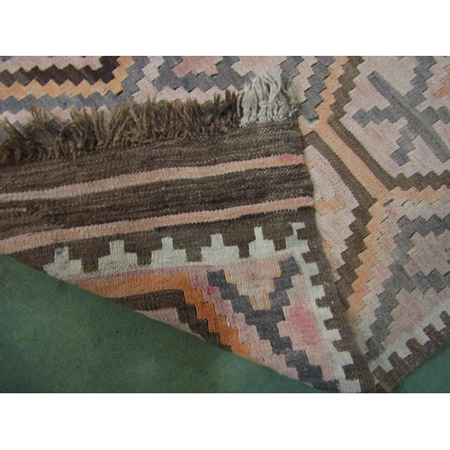 4003 - A peach, grey and brown kilim rug ground with geometric pattern and tasselled ends, 180cm x 98cm