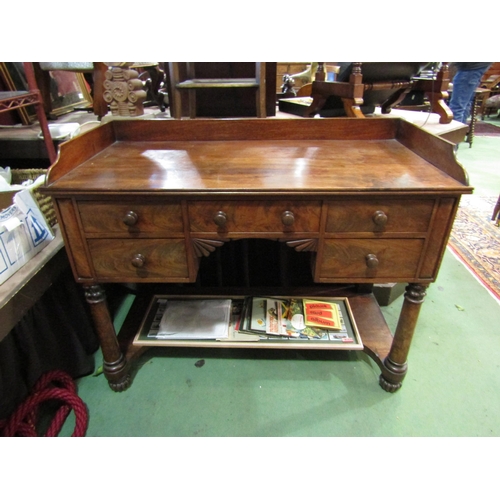 4006 - A William IV mahogany dressing table with three quarter gallery back, five drawers with melon fluted... 