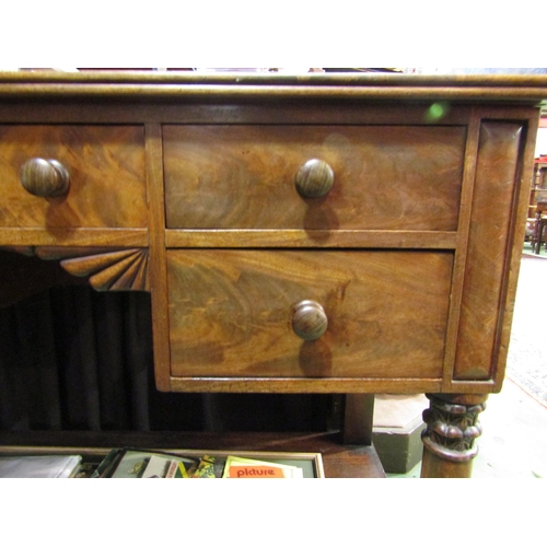 4006 - A William IV mahogany dressing table with three quarter gallery back, five drawers with melon fluted... 