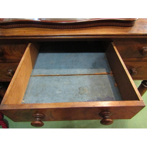 4006 - A William IV mahogany dressing table with three quarter gallery back, five drawers with melon fluted... 