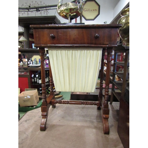 4011 - A Victorian flame mahogany work table with single end drawer and three faux over a wool drawer on ri... 