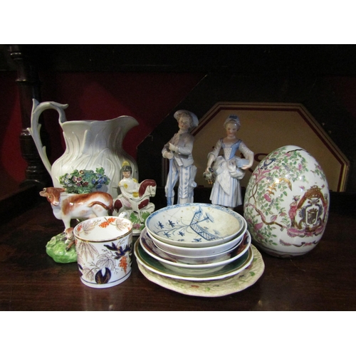 4023 - Assorted saucers, a Victorian cream glazed jug with bullrush design, a pair of Continental figures, ... 