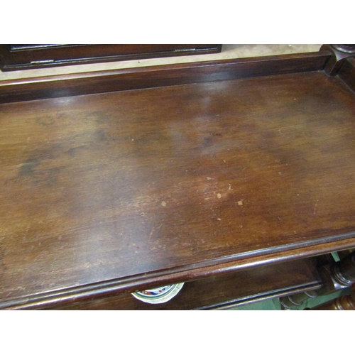 4024 - A circa 1840 mahogany two tier buffet/serving table the three quarter raised shelves and turned supp... 