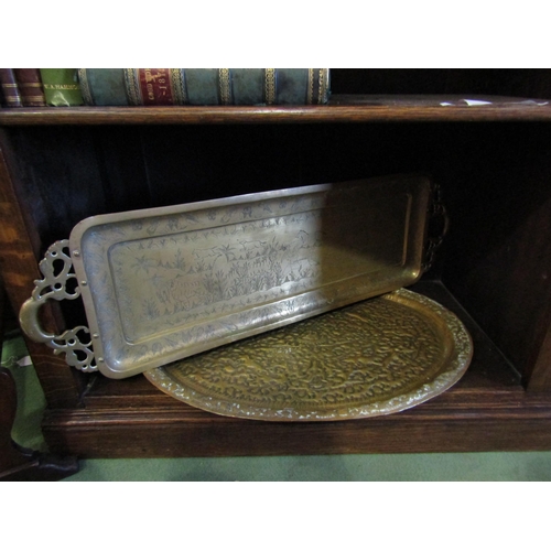 4033 - A circa early 20th Century hammered brass repousse work tray, with another similar (2)   (R)  £10