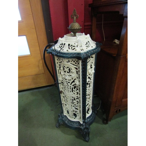 4035 - A late 19th / early 20th Century cast iron and enamelled conservatory heater, 102cm high