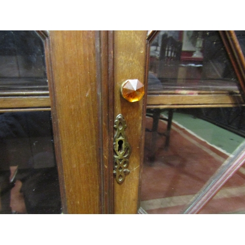 4049 - A Victorian mahogany astragal glazed two door bookcase with height adjustable shelves over ogee brac... 