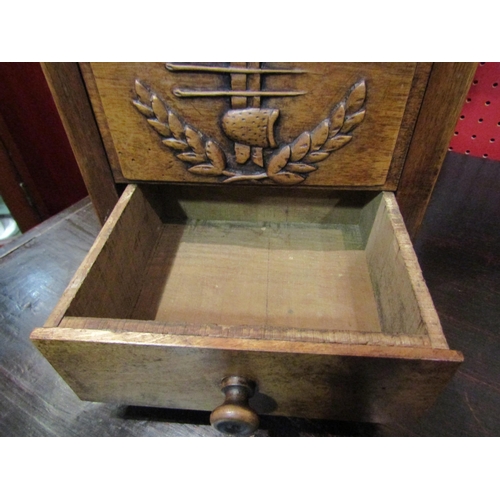 4059 - A 19th Century walnut hinged lid candle box with fret handle over a carved sewing accoutrement panel... 