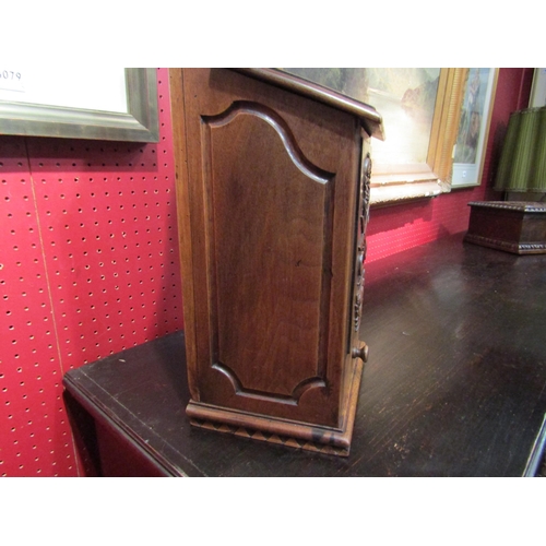 4059 - A 19th Century walnut hinged lid candle box with fret handle over a carved sewing accoutrement panel... 