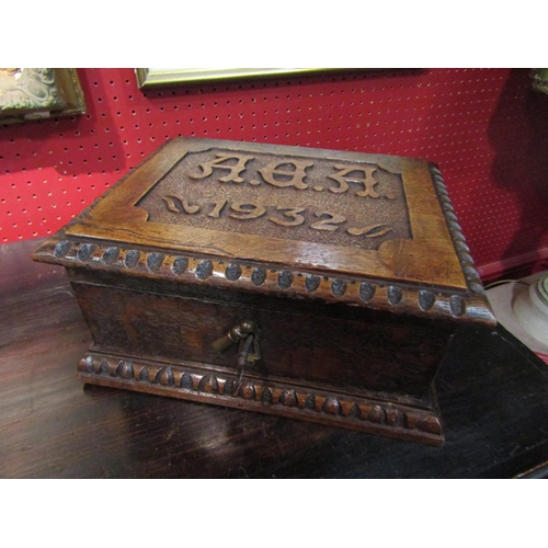 4061 - An oak table-top casket with lift-out two division internal tray dated 1932 with carved monogrammed ... 