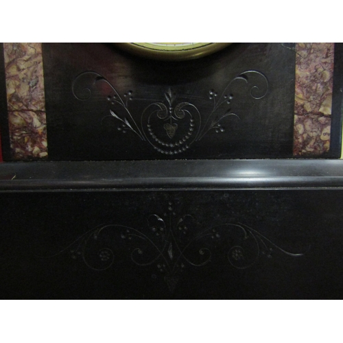 4072 - A 19th Century slate mantel clock, flanked by marble inserts, Roman numeral dial, pediment top, with... 