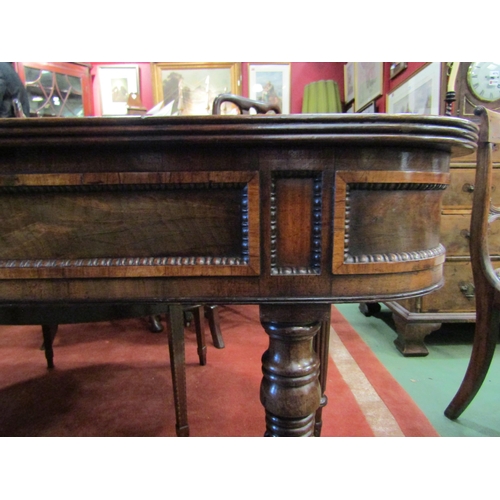 4089 - A Regency flame mahogany D-end table with bobbin turned moulded decorated recessed panel frieze over... 