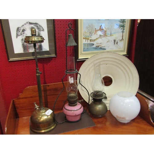 4117 - Three oil lamps including slender brass example and lantern together with an enamel shade