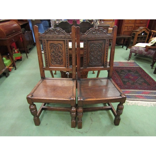 4125 - A pair of Titchmarsh & Goodwin 17th Century revival carved oak chairs with panel seat over turned fo... 