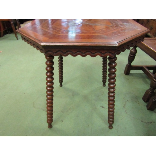 4127 - An early Victorian mixed wood veneered octagonal top lamp table on bobbin turned leg supports, 67cm ... 