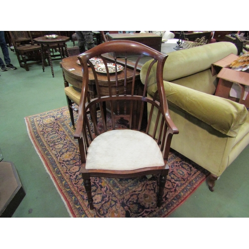 4135 - An Arts & Crafts walnut open armchair in the manner of Jas. Shoolbred with spindle backrest the serp... 