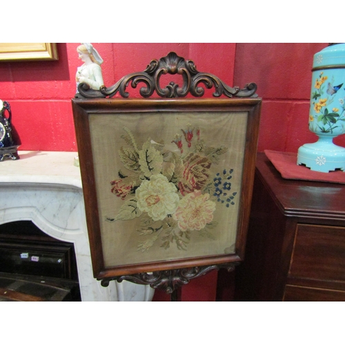 4184 - A 19th Century rosewood pole screen with needlepoint panel depicting flower spray, 32cm x 30cm, tref... 