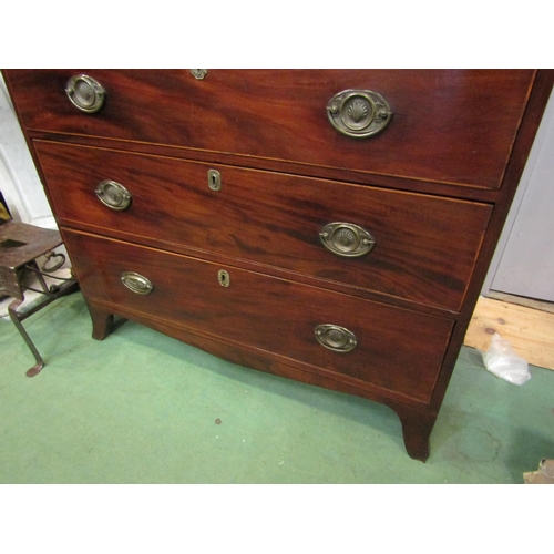 4190 - A George III mahogany chest the reeded edge top over five graduating long drawers on outswept bracke... 