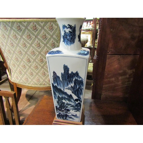 4231 - A circa mid-20th Century Chinese blue and white table lamp with pleated shade on wooden base