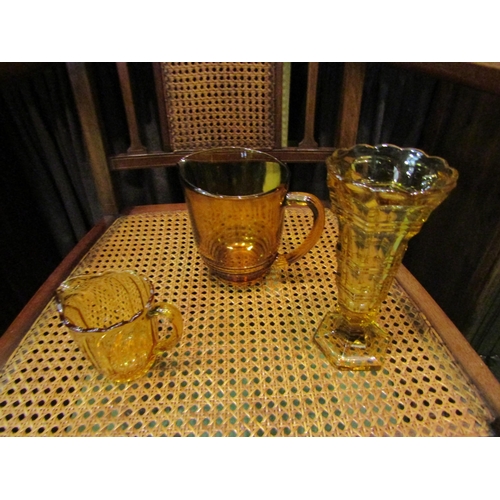 4234 - A selection of Art Deco amber coloured glassware including vases and bowls