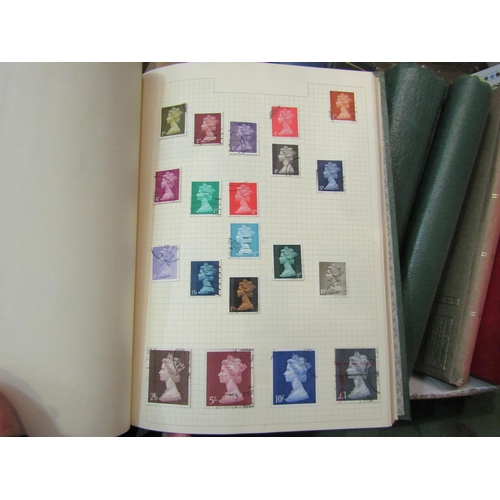 4238 - A box containing approximately 11 albums of British and World stamps mostly dating from mid to late ... 