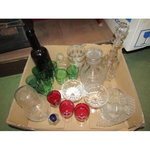 4267 - A box of various glassware including decanters, coloured glasses, bottle and carafe etc.