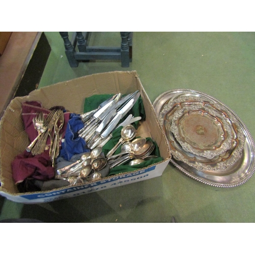 4268 - A box containing a quantity of EPNS Kings pattern cutlery, two graduated ornate plated dishes and a ... 