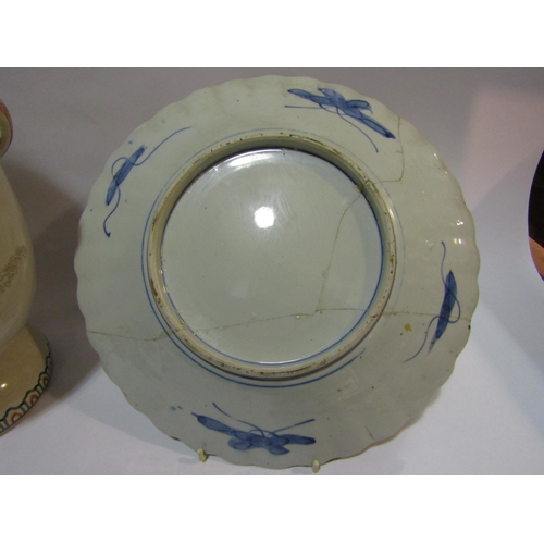 4302 - A Japanese Imari pattern charger with scalloped edge, heavily repaired, and an Oriental vase with bi... 