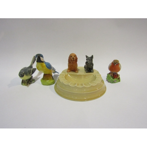 4303 - A Branksome china ashtray surmounted by dogs and three china bird figures including Beswick Grey Wag... 