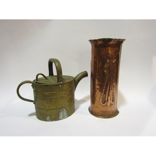 4314 - A copper Trench Art shell, 27cm high, and a brass watering can (2)