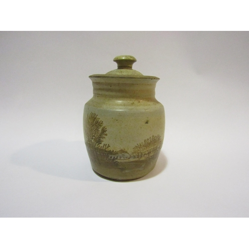 4323 - A Studio pottery lidded jar depicting trees and naturalistic setting, 17cm high   (R)  £10