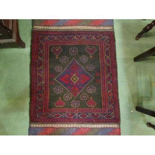 4138 - An Eastern rug, red and blue ground, central diamond with multiple borders, tasselled ends, 145cm x ... 