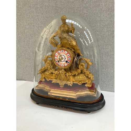 7011 - A 19th Century French ormolu figural mantel clock, surmounted by a maiden, scroll and foliate design... 