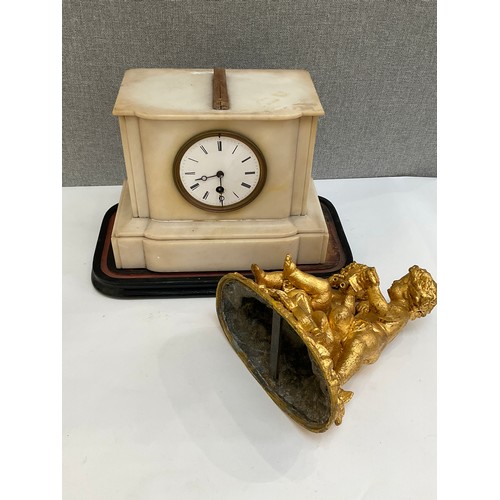 7012 - A 19th Century French alabaster mantel clock, gilded figural top, cracked to reverse, glass missing,... 