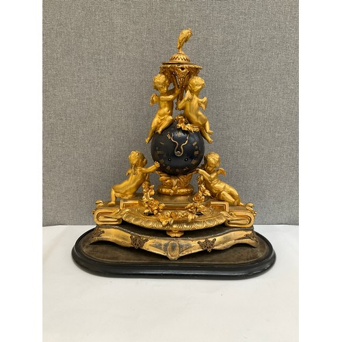 7014 - A French ormolu figural mantel clock of globe form with Olivant & Botsford of Paris movement, highly... 