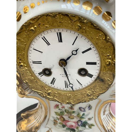 7020 - A 19th Century Valery of Paris ceramic clock enriched with gilt and floral sprays, enamel face a/f, ... 