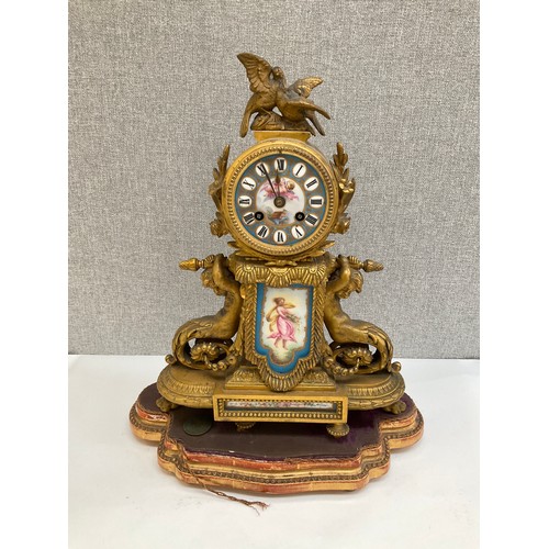 7025 - A 19th Century ormolu and Sevres style panel figural mantel clock with merman style mounts, on gilt ... 